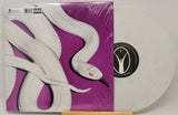 Front cover of Deftones Private Music LP featuring a coiled white snake on vivid purple background and limited edition white vinyl visible.