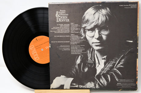 Vinyl record with a cover featuring a person holding a guitar on a white background