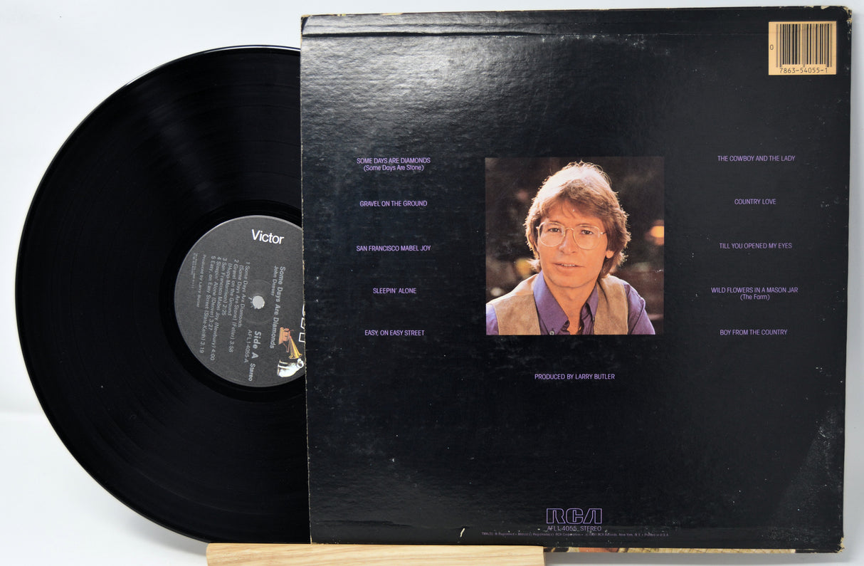 Vinyl record with cover featuring a portrait and text on a white background
