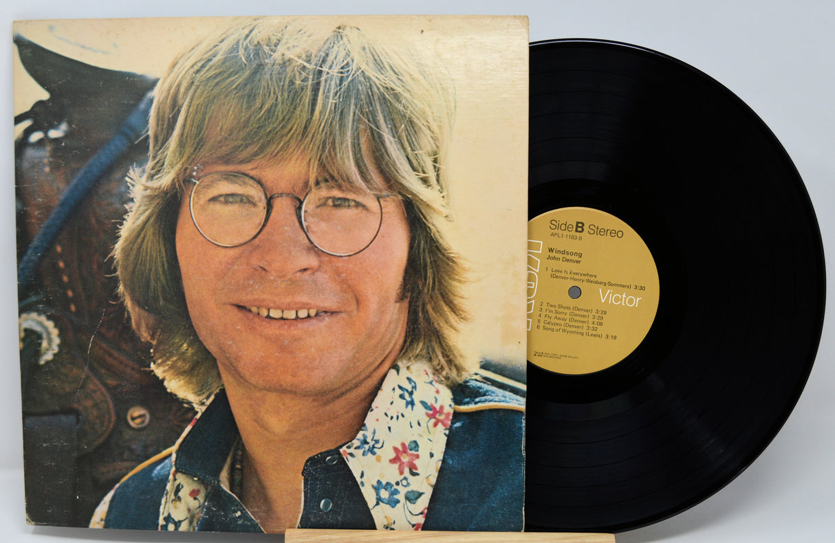 Vinyl record with a portrait of a person on the cover and a horse in the background