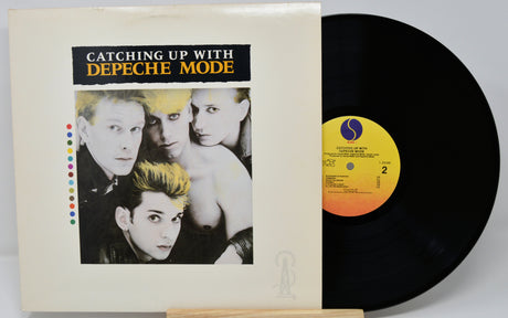 Vinyl record and cover titled 'Catching Up with Depeche Mode' on a white background