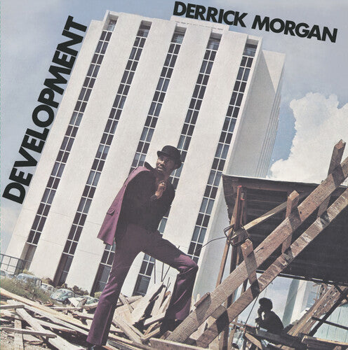 Album cover with a person standing on construction debris, a building in the background, and text 'Derrick Morgan' and 'Development'.