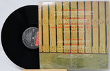 Vinyl record with a wooden sleeve featuring text