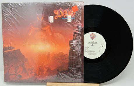 Vinyl record with a fiery album cover on a white background