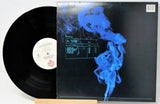 Vinyl record with a blue smoke design on the cover