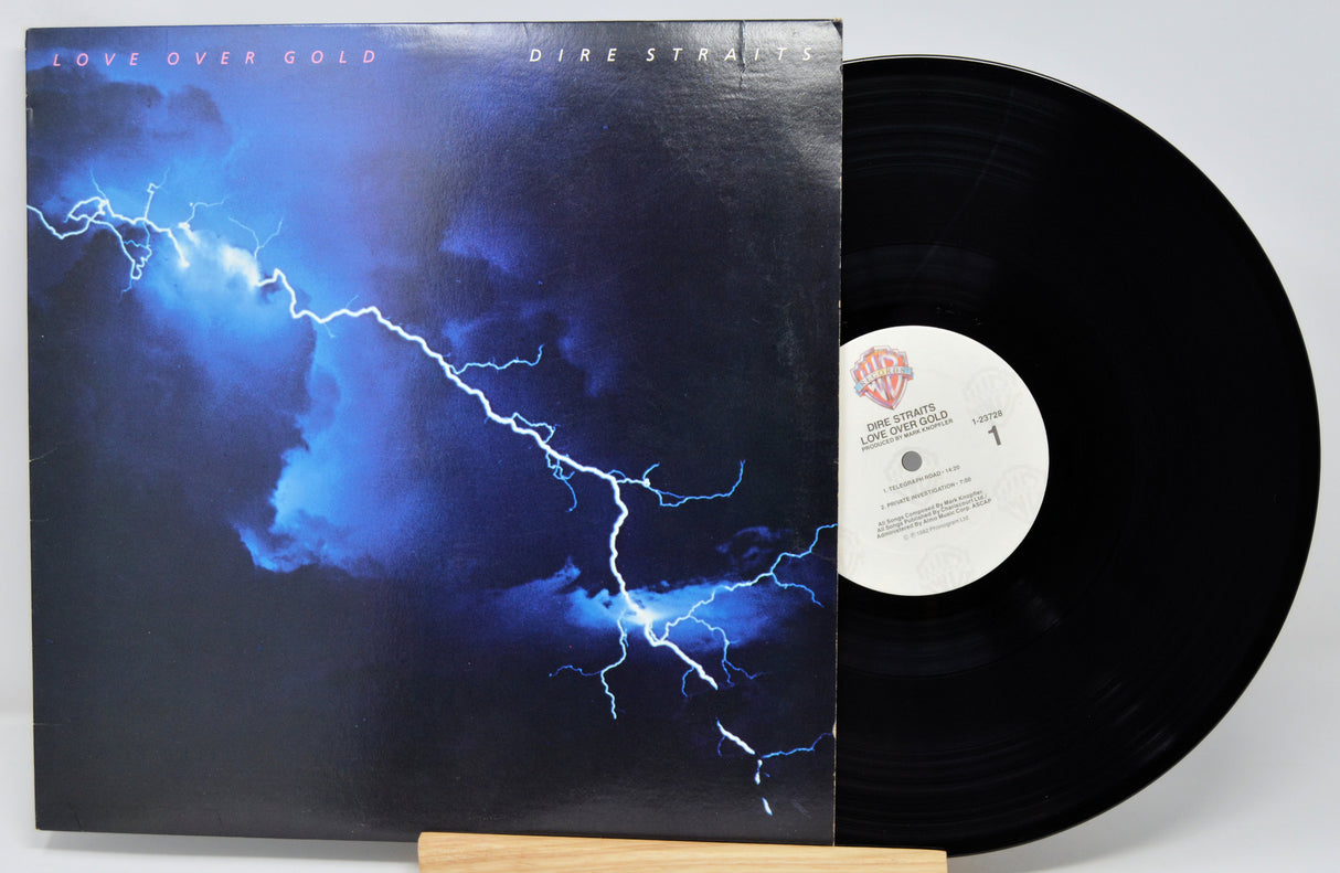 Vinyl record with a blue lightning design on the cover and a white label.