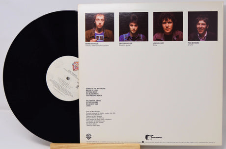Vinyl record with a white label and cover featuring four album tracks.