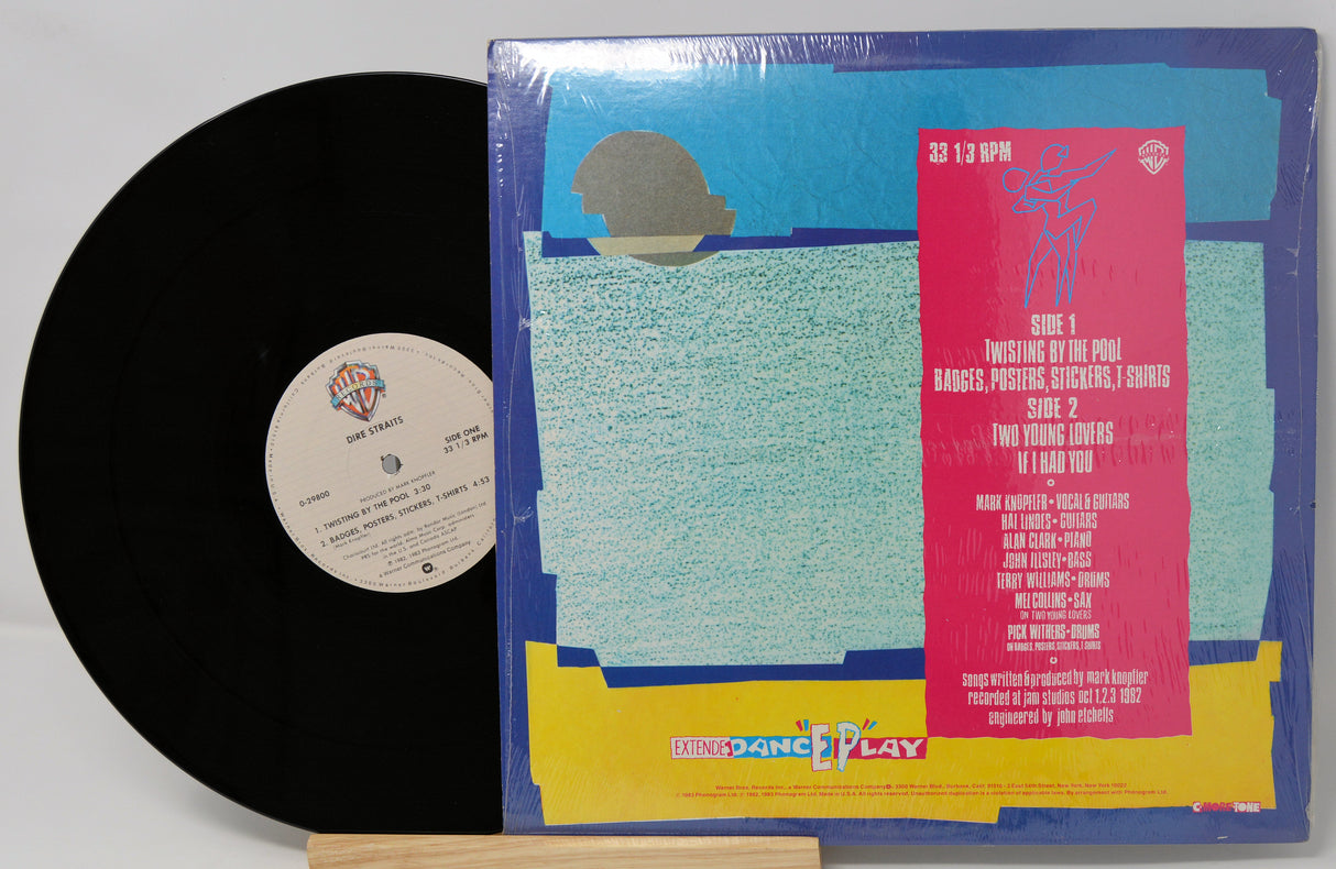 Vinyl record with colorful cover featuring text and graphics on a white background