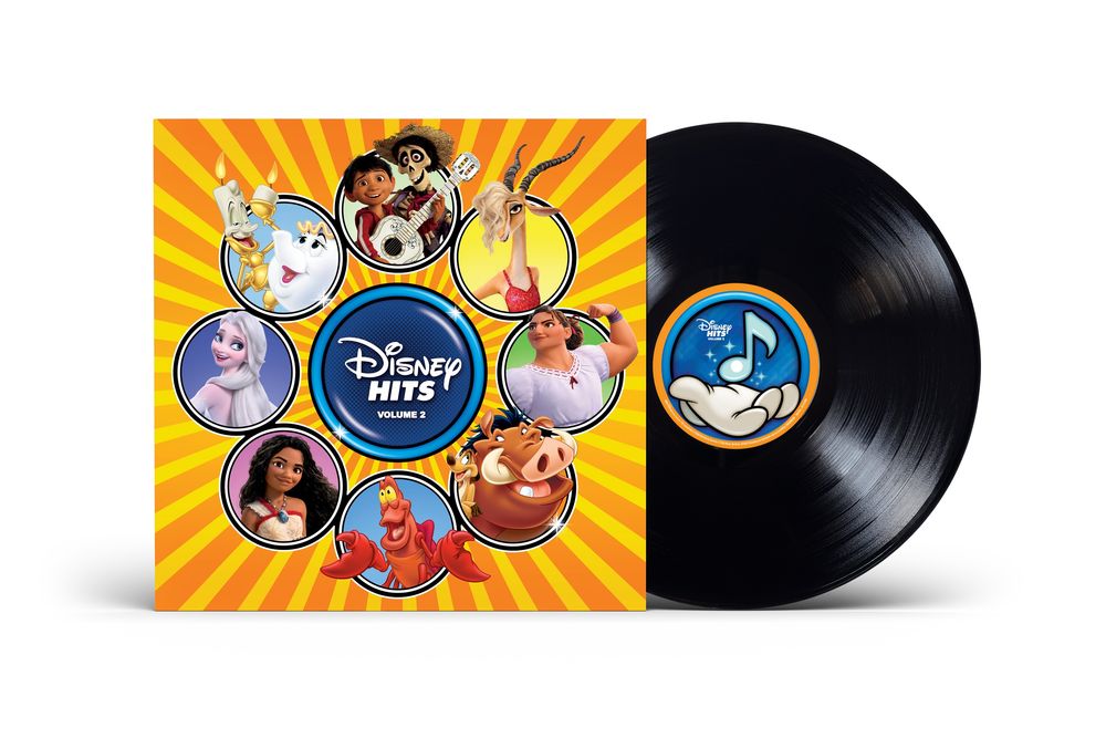 Disney Hits Volume 1 vinyl record album with its illustrated cover sleeve and a black vinyl record partially pulled out, shown on a white background.