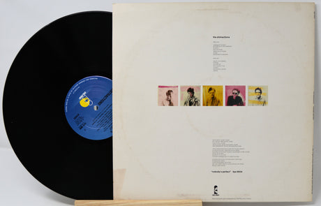 Vinyl record with cover featuring album artwork and text