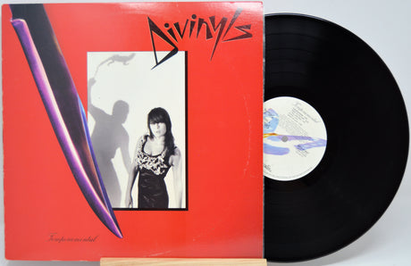 Vinyl record with a red cover featuring a black and white photo of a woman and the word 'Divinyls'.