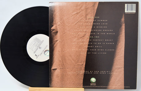 Vinyl record with a brown textured cover and white label on a light gray background