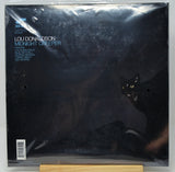 Lou Donaldson's 'Midnight Creeper' vinyl record album cover, sealed in its original plastic shrink-wrap and displayed on a wooden stand against a neutral gray background.