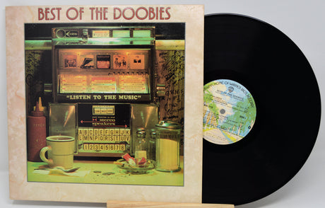 Vinyl record and cover titled 'Best of the Doobies' with a jukebox scene on the cover.