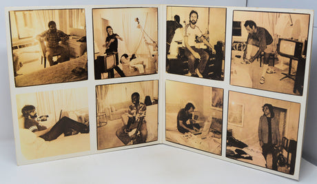 Set of eight black and white photos displayed on a white surface