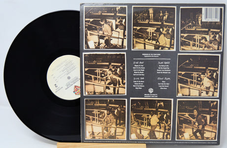 Vinyl record with a detailed cover featuring black and white images of a boxer in action.