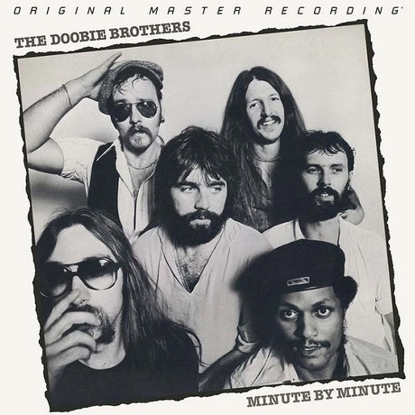 Black and white album cover of The Doobie Brothers with band members posing.