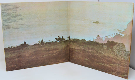 Open book with a landscape illustration of people on horseback and text on a white background