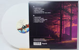 Vinyl record with a cover featuring a forest scene and tracklist.