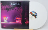 Vinyl record with cover featuring a gas station at night and 'doves' album text.