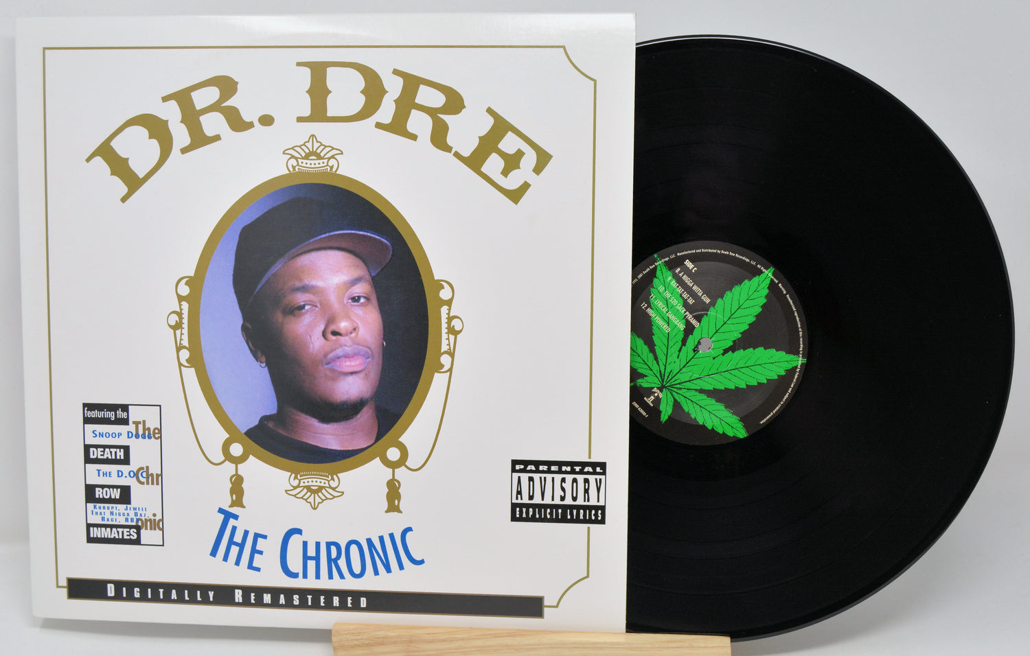 Vinyl record and cover of 'The Chronic' by Dr. Dre on a white background
