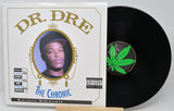 Vinyl record and cover of 'The Chronic' by Dr. Dre on a white background