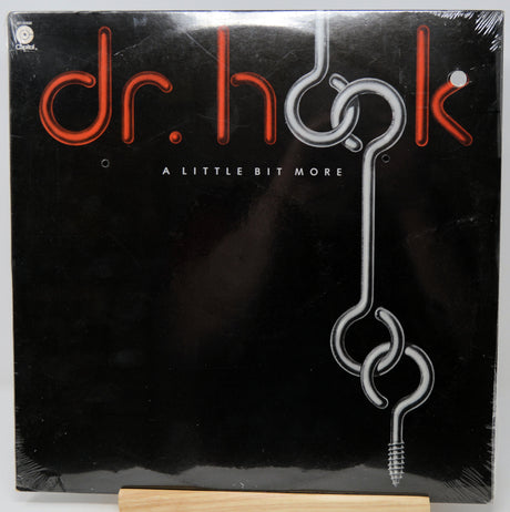 Vinyl record cover for 'A Little Bit More' by Dr. Hook on a black background.