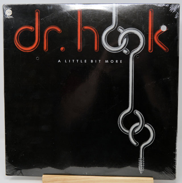 Vinyl record cover for 'A Little Bit More' by Dr. Hook on a black background.