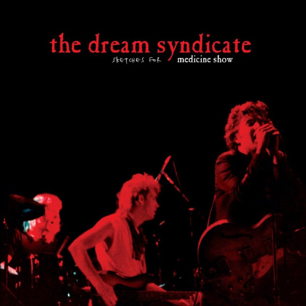 Album cover with 'the dream syndicate' and two people on stage in red lighting.
