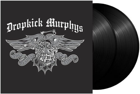 Dropkick Murphys double vinyl record album with the black sleeve featuring a white gothic logo and winged skull graphic, next to two black vinyl records.