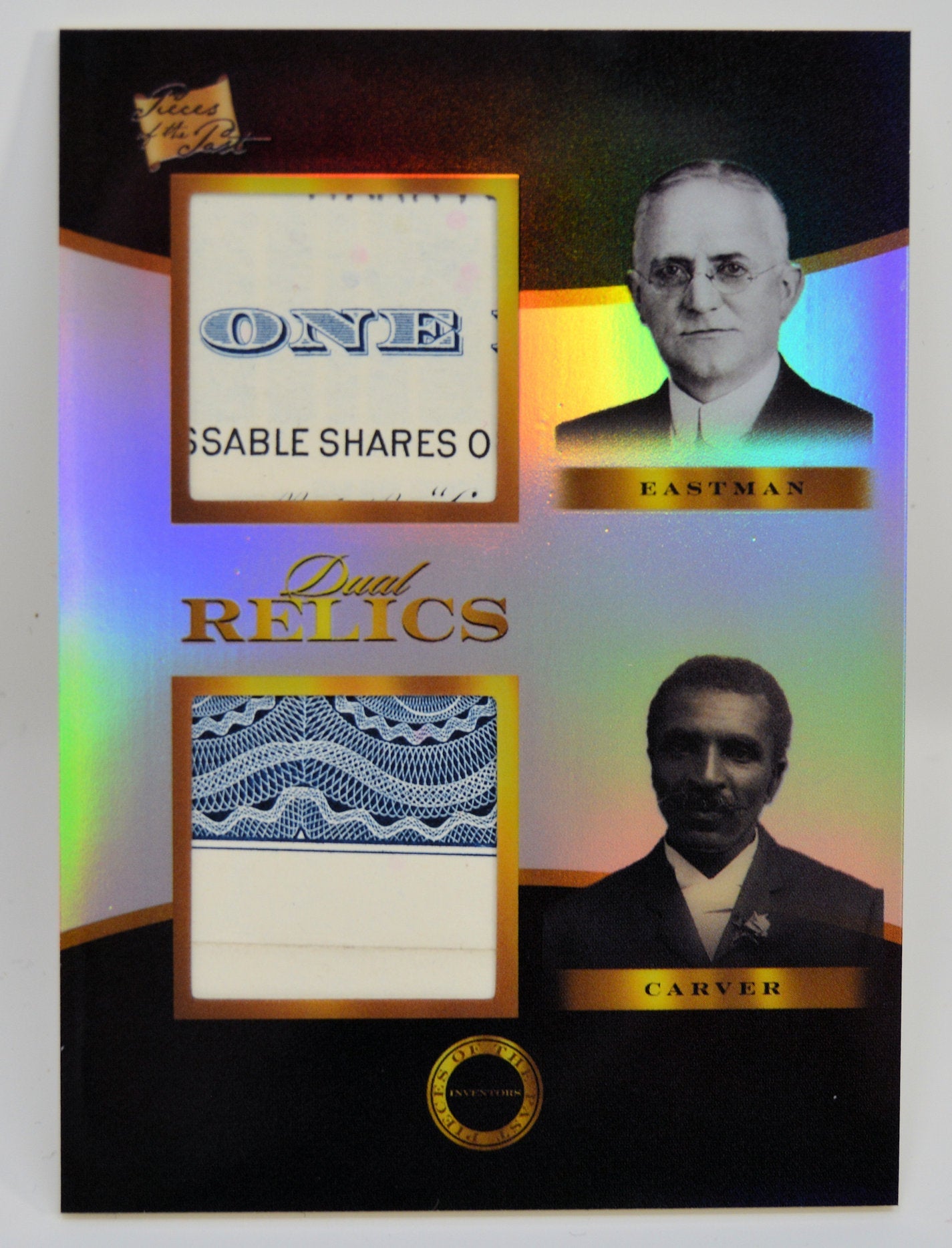 Dual Relics card with holographic background featuring relic fragments and portraits of George Eastman and George Washington Carver