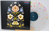 Vinyl record with decorative cover and multicolored label