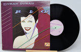 Vinyl record and cover for Duran Duran album 'Rio' on a white background