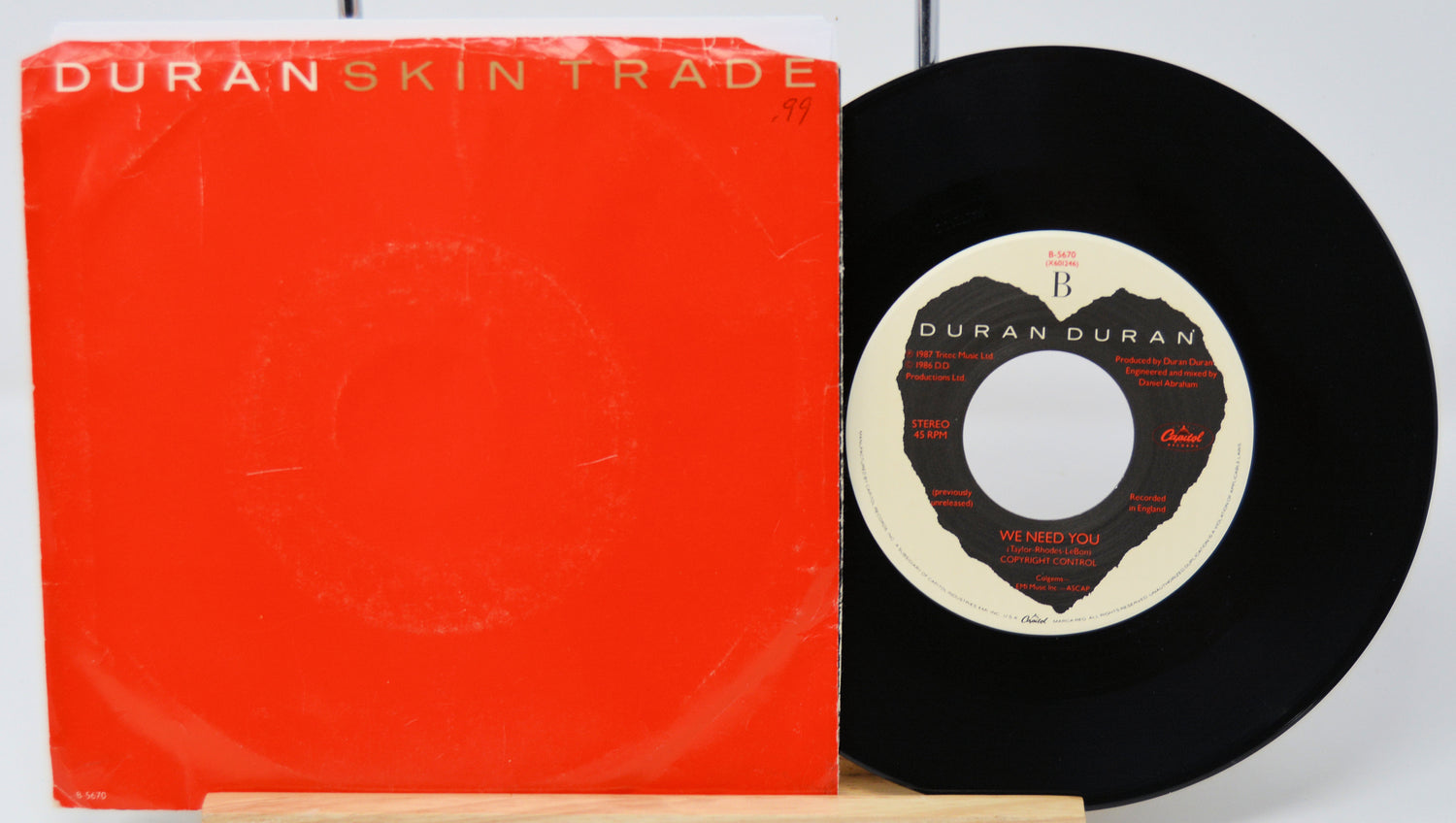 Vinyl record with red cover and 'Duran Duran' branding on a white background