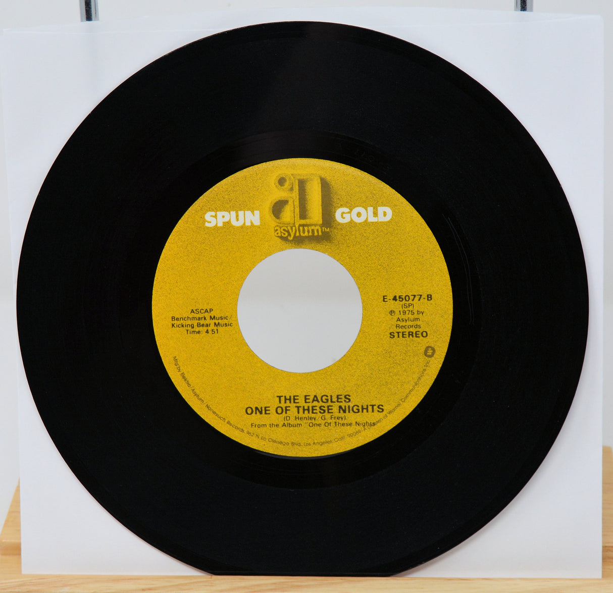 Vinyl record with yellow label featuring 'Spun Gold' and 'Asylum' logos, on a white background.