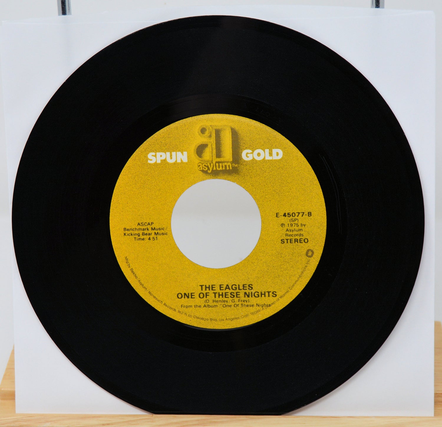 Vinyl record with yellow label featuring 'Spun Gold' and 'Asylum' logos, on a white background.