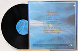 Vinyl record with blue label and cover featuring text