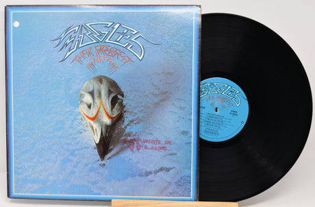 Vinyl record with a blue cover featuring a fish skull illustration and the band's name.