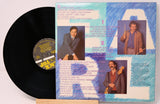 Vinyl record with a colorful back cover featuring images of a man and text.