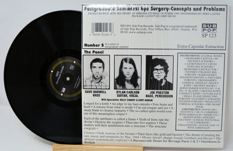 Back cover of Earth’s 'Extra-Capsular Extraction' LP showing band panel, credits, and track details