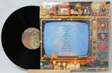 Vinyl record with colorful cover featuring a vintage television design.
