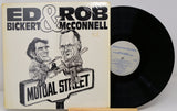 Front cover of Ed Bickert & Rob McConnell's 'Mutual Street' vinyl showing caricature artwork