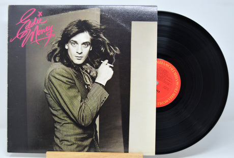 'Eddie Money Self Titled' Vinyl record with cover featuring Eddie and text on a white background