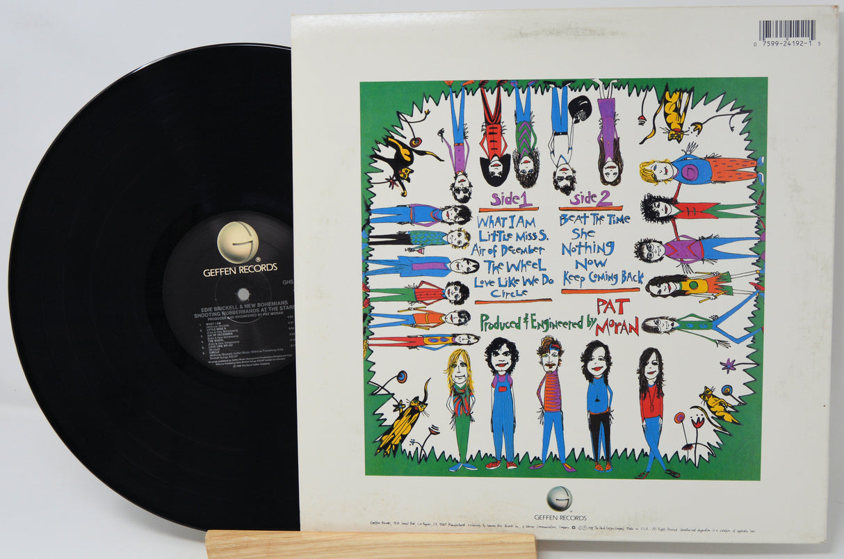 Vinyl record with colorful cover featuring illustrated characters and text