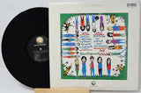 Vinyl record with colorful cover featuring illustrated characters and text