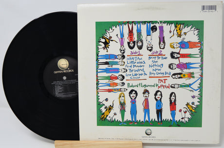 Vinyl record with colorful cover featuring illustrated characters and text