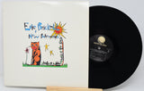 Vinyl record with cover featuring a colorful illustration of a cat and sun.