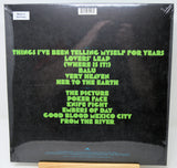 Vinyl record cover with green text on a black background