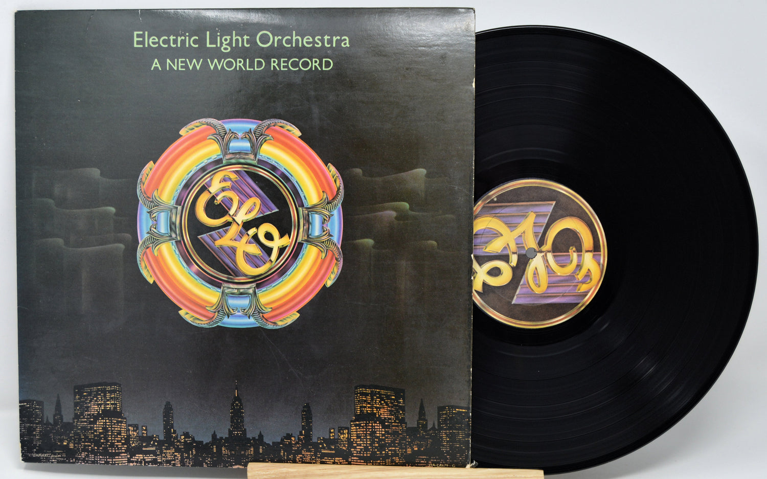 Electric Light Orchestra vinyl album 'A New World Record' with cover and record on a white background