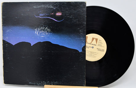 Vinyl record with cover featuring a mountain landscape and 'Electric Light Orchestra' branding.